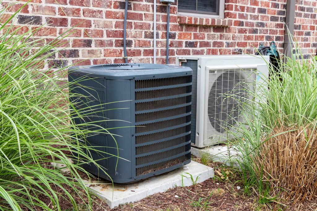 Air Conditioner Repair - AC units next to home